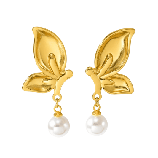 Gold leaf earrings with pearl drops on a white background