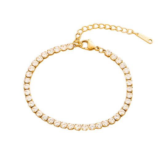 Gold bracelet with clear stones on a white background