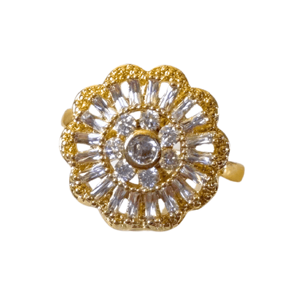 Gold and crystal brooch on a white background