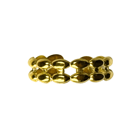 Gold ring with a honeycomb design on a white background