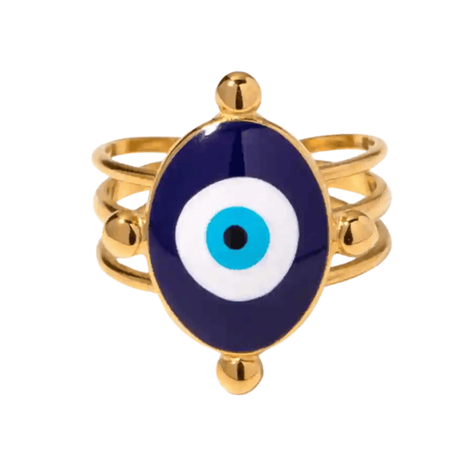 Gold ring with a blue evil eye design on a white background