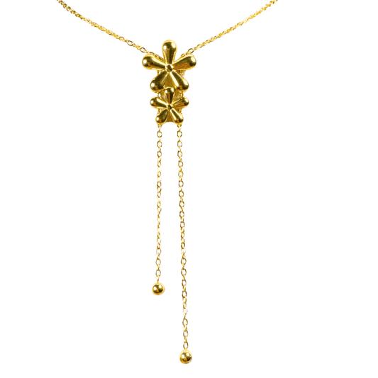 Gold necklace with a star-shaped pendant on a white background