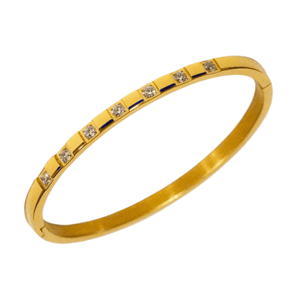 Gold bracelet with embedded diamonds on a white background