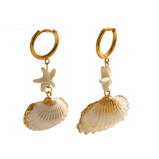 Pair of gold hoop earrings with shell and starfish charms on a white background
