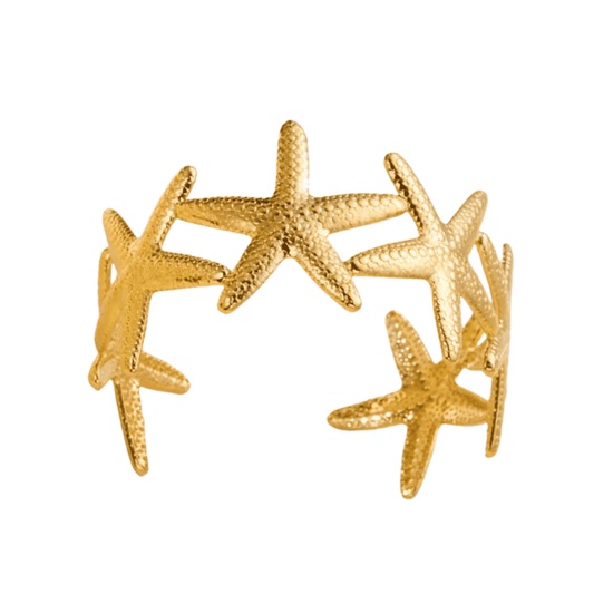 Gold starfish bracelet on a white background