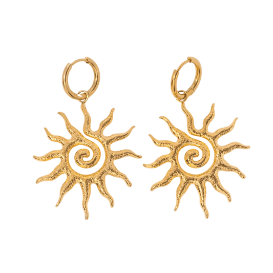 Gold sun-shaped earrings on a white background