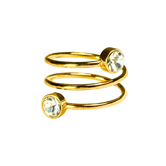 Gold spiral ring with crystal beads on a white background