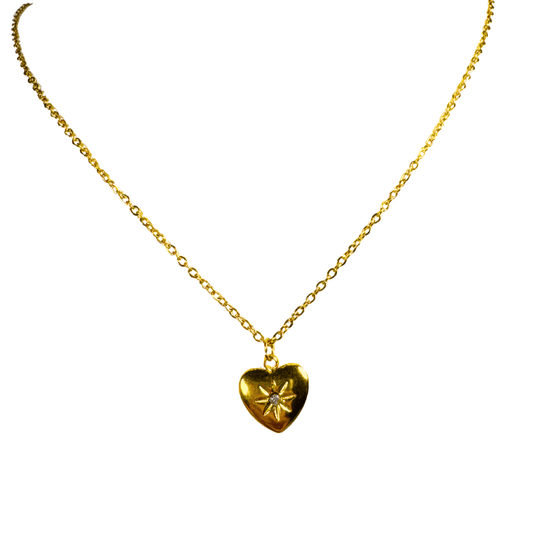 Gold heart-shaped pendant necklace on a white background