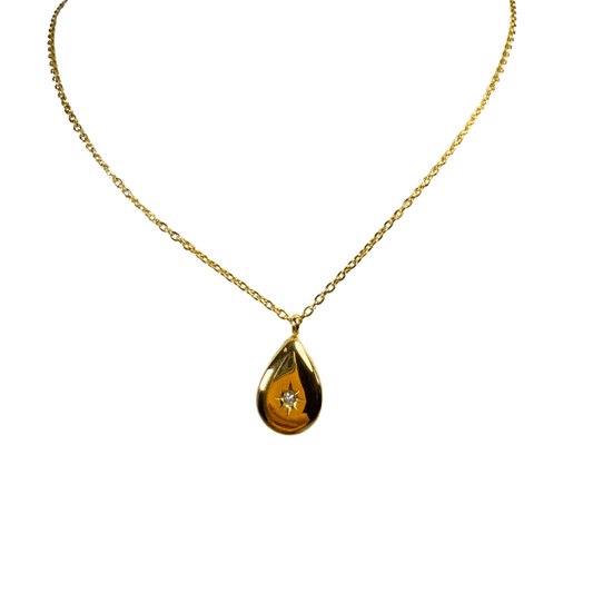 Gold necklace with a teardrop-shaped pendant on a white background