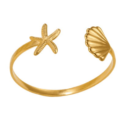Gold ring with starfish and shell designs on a white background