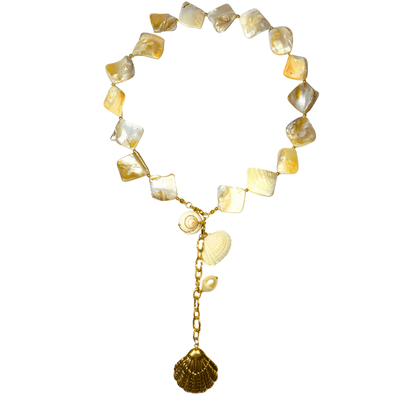 Necklace with yellow and white heart-shaped beads and a gold chain on a white background