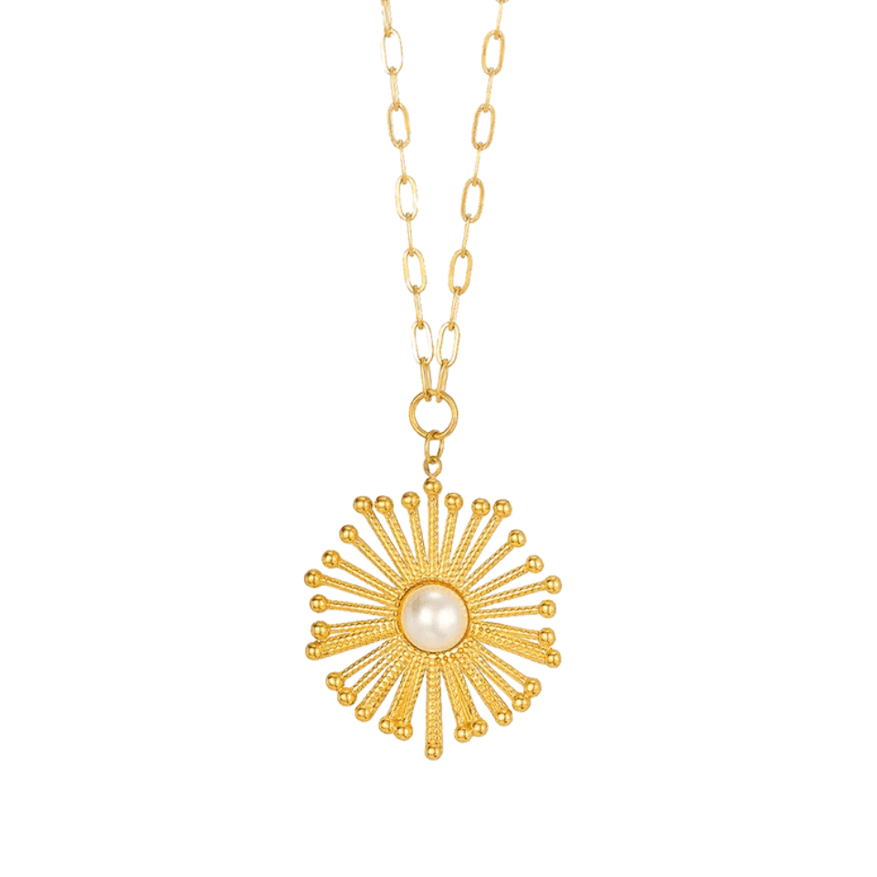 Gold necklace with a sunburst pendant featuring a pearl on a white background