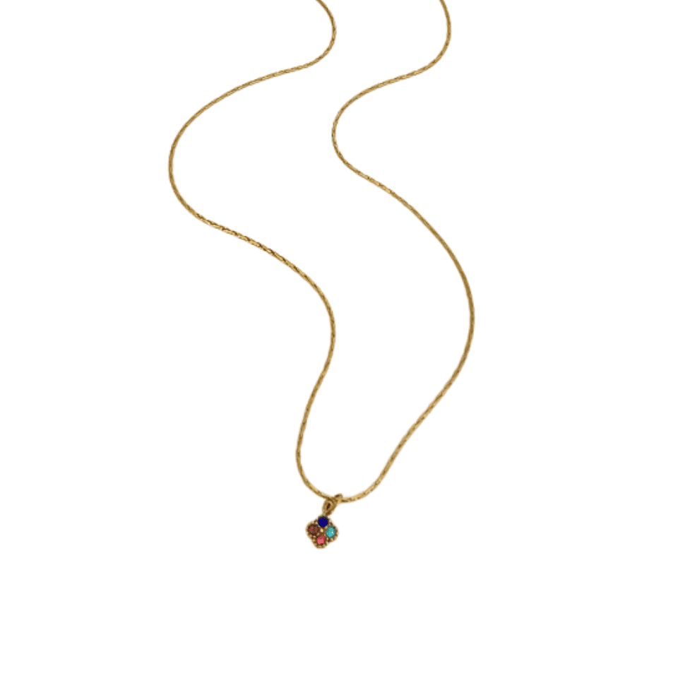 Gold necklace with a small pendant on a white background