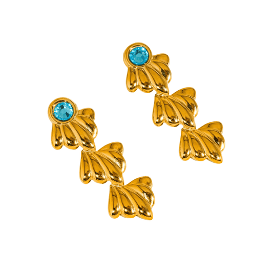 Gold butterfly-shaped earrings with blue gemstones on a white background