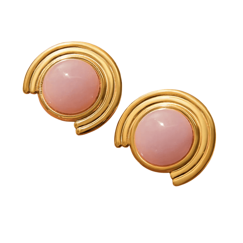 Pair of gold earrings with pink gemstones on a white background