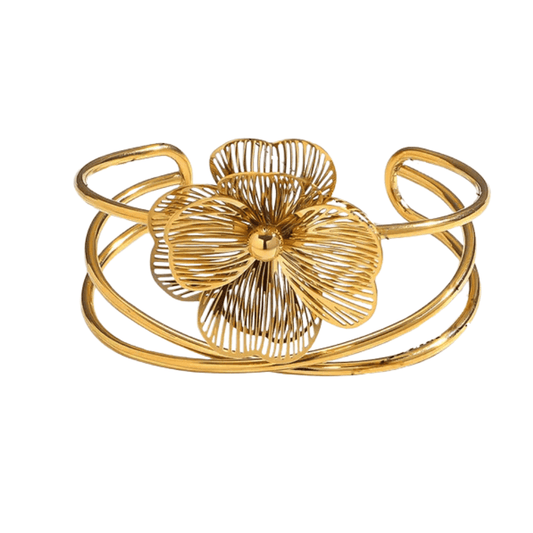 Gold bracelet with a floral design on a white background