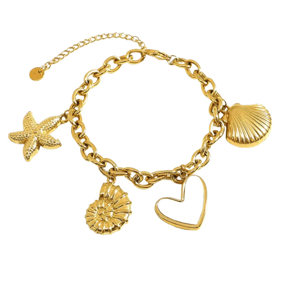 Gold bracelet with various charms including a starfish, shell, and heart on a white background