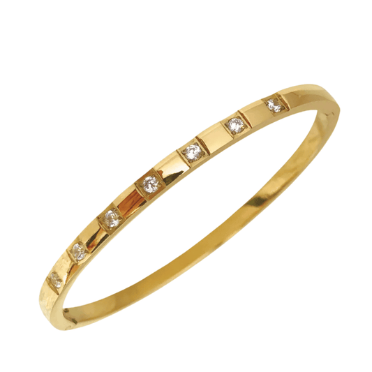 Gold bracelet with embedded diamonds on a white background