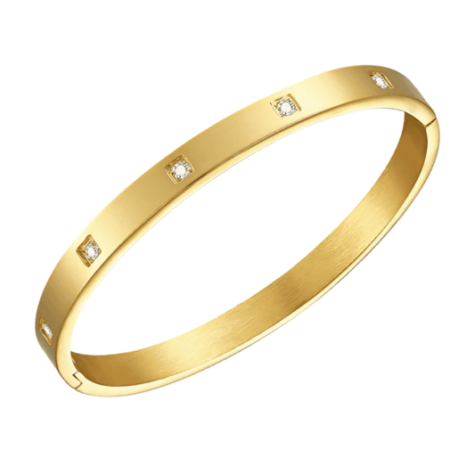 Gold bracelet with embedded diamonds on a white background